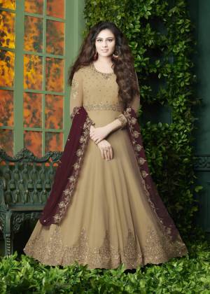 Flaunt Your Rich And Elegant Look Wearing This Designer Floor Length Suit In Beige Color Paired With Beige Colored Bottom And Maroon Colored Dupatta. It Top Is Fabricated On Georgette Paired With Santoon Bottom And Georgette Dupatta. It Has Very Pretty Embroidery over The Top And Dupatta. Buy Now.