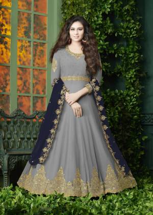 Flaunt Your Rich And Elegant Look Wearing This Designer Floor Length Suit In Grey Color Paired With Grey Colored Bottom And Navy Blue Colored Dupatta. It Top Is Fabricated On Georgette Paired With Santoon Bottom And Georgette Dupatta. It Has Very Pretty Embroidery over The Top And Dupatta. Buy Now.