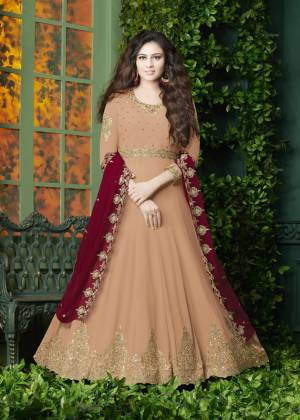 Flaunt Your Rich And Elegant Look Wearing This Designer Floor Length Suit In Peach Color Paired With Peach Colored Bottom And Red Colored Dupatta. It Top Is Fabricated On Georgette Paired With Santoon Bottom And Georgette Dupatta. It Has Very Pretty Embroidery over The Top And Dupatta. Buy Now.