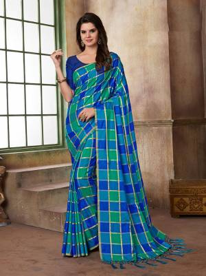 Grab This Beautiful Checks Printed Saree In Blue And Green Color Paired With Royal Blue Colored Blouse. This Saree And Blouse Are Silk based Which Also Gives A Rich Look To Your Personality. 