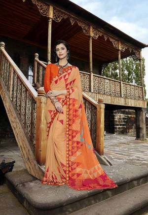 Pretty Attractive Shades Are Here With This Saree In Light Peach Color Paired With Orange Colored Blouse. This Saree Is Georgette Based Paired With Art Silk Fabricated Blouse. It Has Prints And Embroidered Lace Border. 