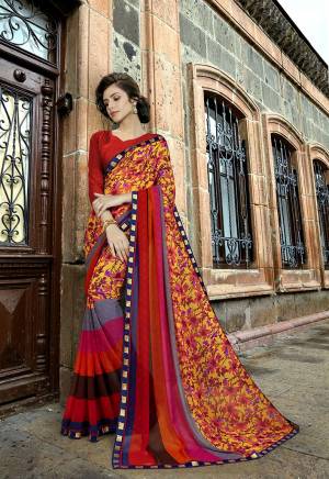Go Colorful With This Pretty Saree In Multi Color Paired With Red Colored Blouse. This Saree Is Fabricated On Georgette Beautified With Prints And Embroidered Lace Border Paired With Art Silk Fabricated Blouse. 