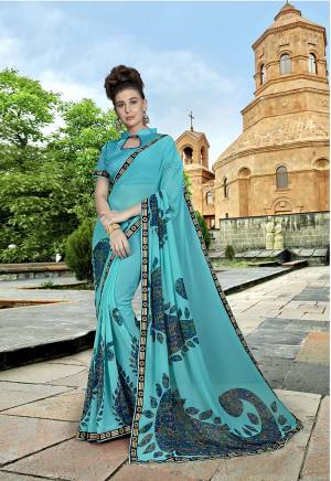 Rich And Elegant Looking Saree Is Here In Turquoise Blue Color Paired With Turquoise Blue Colored Blouse. This Saree Is Fabricated On Georgette Paired With Art Silk Fabricated Blouse. It Has Simple Prints And Pretty Lace Border. 