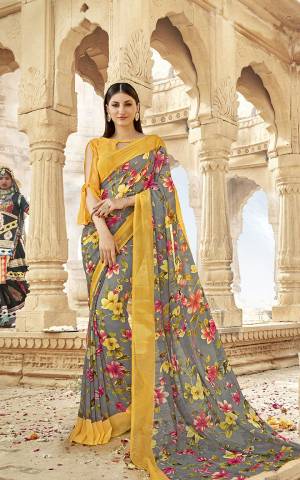 Get This Pretty Georgette Based Saree For Your Casual Wear. This Saree And Blouse Are Fabricated On Georgette Beautified With Prints All Over. Buy Now.