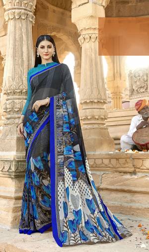 Add Some Casuals With This Pretty Saree To Your Wardrobe. This Saree And Blouse Are Georgette Based Beautified With Prints All Over It. Grab It Now Before The Stock Ends.