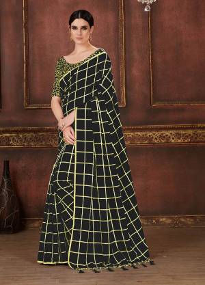 Celebrate This Festive Season Wearing This Beautiful Designer Checks Printed Saree In Black Color Paired With Black Colored Blouse. This Saree And Blouse Are Silk Based Which Also Gives A Rich Look To Your Personality. 
