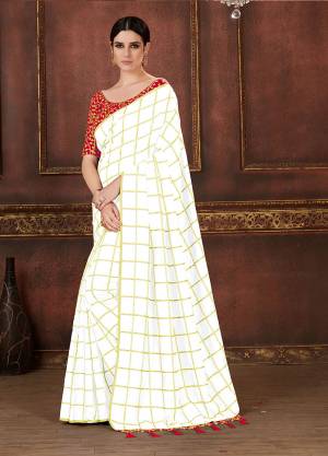 Simple, Elegant And Rich Looking Saree In Here In White Color Silk Based Beautified With Checks Prints Paired With Red colored Embroidered Blouse. It Is Comfortable And Easy To Carry All Day Long. 