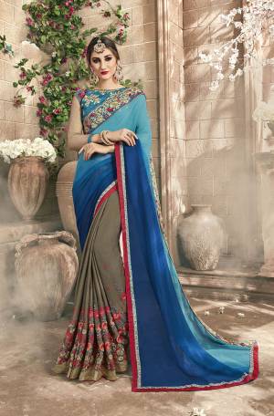 You Will Definitely Earn Lots Of Compliments Wearing This Designer Saree In Blue And Grey Color Paired With Blue And Grey Colored Blouse. This Saree Is Fabricated On Georgette And Chiffon Paired With Art Silk Blouse. 