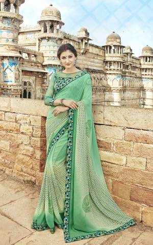 Look Pretty In this Lovely Sea Green Colored Saree Paired With Multi Colored Blouse. This Saree Is Georgette Based Paired With Art Silk And Net Fabricated Blouse. It Is Light In Weight And Easy To Carry All Day Long. 