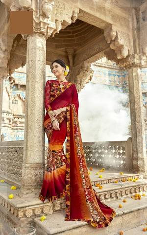 Celebrate This Festive Season Wearing This Attractive Looking Maroon Colored Saree Paired With Multi Colored Blouse. This Printed Saree Is Georgette Based Paired With Art Silk And Net Fabricated Blouse. 
