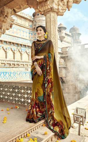 Grab This Quite Unique Patterned Saree In Brown Shade Paired With Multi Colored Blouse. This Saree Is Fabricated On Georgette Paired With Art Silk And Net Fabricated Blouse. Buy Now.