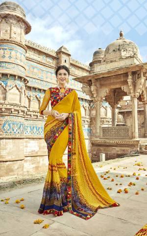 Add This Pretty Saree To Your Wardrobe In Yellow Color Paired With Multi Colored Blouse. This Saree Is Georgette Fabricated Which Is Light In Weight And Durable Paired With Art Silk And Net Fabricated Blouse. 