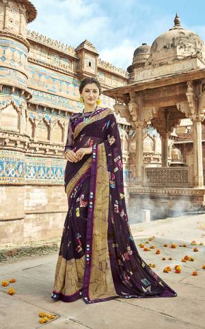 For Your Semi-Casuals, Grab This Pretty Saree In Wine Color Paired With Wine Colored Blouse. This Saree Is Fabricated On Georgette Paired With Art Silk And Net Fabricated Blouse. It Is Beautified With Prints And Lace Border. 