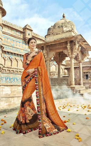 Look Pretty In this Lovely Orange Colored Saree Paired With Multi Colored Blouse. This Saree Is Georgette Based Paired With Art Silk And Net Fabricated Blouse. It Is Light In Weight And Easy To Carry All Day Long. 