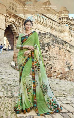 Grab This Quite Unique Patterned Saree In Light Green Shade Paired With Multi Colored Blouse. This Saree Is Fabricated On Georgette Paired With Art Silk And Net Fabricated Blouse. Buy Now.