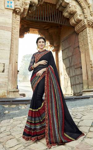 Add This Pretty Saree To Your Wardrobe In Black Color Paired With Multi Colored Blouse. This Saree Is Georgette Fabricated Which Is Light In Weight And Durable Paired With Art Silk And Net Fabricated Blouse. 