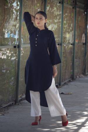 Here Is A Kurti Suitable For Your Casual Wear At Home, Outing Or Your Work Place. This Navy Blue Colored Readymade Kurti Is Fabricated On Rayon Cotton, It Is Easy To Carry And Durable. 