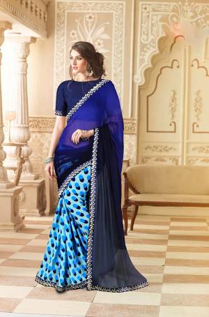 Add This Pretty Attractive Saree To Your Wardrobe In Blue And Light Blue Color Paired With Navy Blue Colored Blouse. This Saree IS Fabricated Weightless Georgette  Paired With Art Silk Fabricated Blouse. 