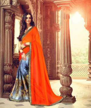 Bright And Visually Appealing Color Is Here With This Saree In Orange And Blue Color Paired With Black Colored Blouse. This Saree Is Georgette Based Paired With Art Silk Fabricated Blouse. It Is Light In Weight And Easy To Carry All Day Long. 