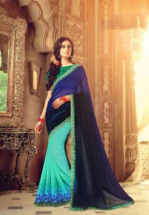 Here Is A Pretty Saree In Shades Of Blue With This Saree In Navy Blue And Sky Blue Color Paired With Contrasting Green Colored Blouse. This Saree Is Georgette Based Paired With Art Silk Fabricated Blouse. Buy Now.