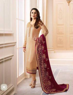 Simple, Elegant And Rich Looking Combination Is Here With This Designer Straight Suit In Beige Color Paired With Maroon Colored Dupatta. Its Top Is Georgette Satin Fabricated Paired With Santoon Bottom And Chiffon Dupatta. It Has Pretty Attractive Embroidery Over The Top And Dupatta. Buy Now.