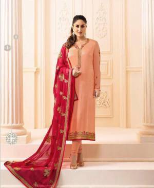 A Must Have Suit In Every Womens Wardorbe Is Here With This Designer Straight Suit In Peach Color Paired With Contrasting Dark Pink Colored Dupatta. Its Embroidered Top Is Fabricated On Georgette Satin Paired With Santoon Bottom And Chiffon Dupatta. Buy Now.