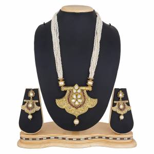 For A Queen Look, Here Is A Designer Royal Looking Necklace Set In Golden Color. This Necklace Set Can Be Paired With Heavy Ethnic Attire For More Enhanced Look. Buy Now.
