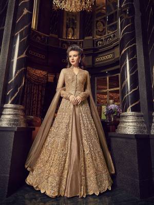 Flaunt Your Rich And Elegant Taste In This Designer Indo-Western Suit In Beige Color. Its Top And Dupatta Are Net Based With Heavy Embroidery, Available With A Lehenga And Embroidered Pants. Its Lehenga And Pants Are Fabricated On Art Silk. You Can Pair With Any Of Them As Per The Occasion.