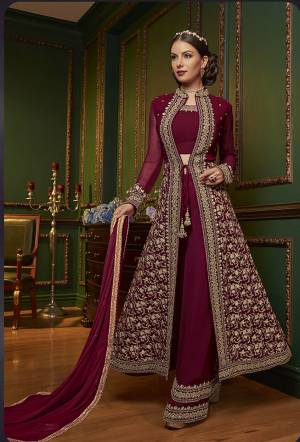 New Patterned Designer Indo-Western Dress Is Here In Maroon Color. It Has Heavy Embroidered Top And Plazzo Pants Fabricated On Georgette Paired With Chiffon Dupatta. This Pretty Designer Dress Will Definitely Earn You Lots Of Compliments From Onlookers.