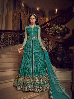 Flaunt Your Rich And Elegant Taste In This Designer Indo-Western Suit In Teal Blue Color. Its Top And Dupatta Are Net Based With Heavy Embroidery, Available With A Lehenga And Embroidered Pants. Its Lehenga And Pants Are Fabricated On Art Silk. You Can Pair With Any Of Them As Per The Occasion.