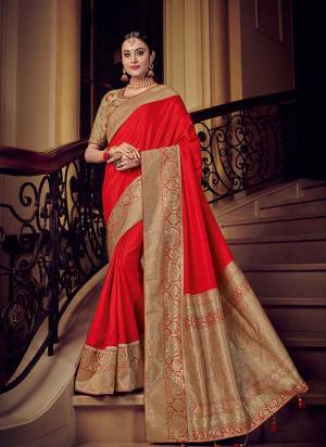 marvelously charming is what you will look at the next wedding gala wearing this beautiful red and gold color silk fabric with rich jacquard pallu saree. Ideal for party, festive & social gatherings. this gorgeous saree featuring a beautiful mix of designs. Its attractive color and designer heavy design, stone design, silk fabric with rich jacquard pallu and beautiful design all over work over the attire & contrast hemline adds to the look. Comes along with a contrast unstitched blouse.