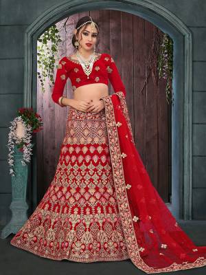 Here Is A Perfect Bridal Look For You With This Heavy designer Lehenga Choli In Red Color. This Lehenga Choli Is Velvet Based Paired With Net Fabricated Dupatta.Its Fabric Also Ensures Superb Comfort Throughout The Gala.