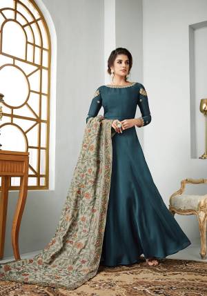 New Shade Is Here To Add Into Your Wardrobe With This Designer Floor Length Suit In Prussian Blue Color Paired With Contrasting Grey Colored Dupatta. Its Top Is Fabricated On Satin Georgette Paired With Santoon Bottom and Art Silk Dupatta. Buy Now.