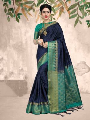 Here Is A Very Beautiful Silk Based Saree In Navy Blue Color Paired With Turquioise Blue Colored Blouse. This Saree And Blouse Are Fabricated On Embossed Jacquard Beautified With Weave All Over. 