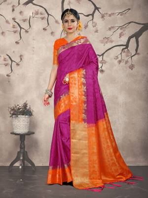 Here Is A Very Beautiful Silk Based Saree In Rani Pink Color Paired With Orange Colored Blouse. This Saree And Blouse Are Fabricated On Embossed Jacquard Beautified With Weave All Over. 