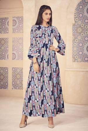 Rich And Elegant Looking Designer Readymade Kurti Is Here In Grey And Blue Color Fabricated On Cotton. This Kurti Is Beautified With Abstract Prints All Over With A Lovely Color Pallete. 