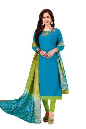 Simple Dress Material Is Here For Your Semi-Casuals With This Dress Material In Sky Blue Colored Top Paired With Contrasting Light Green Colored Bottom And Shaded Green And Blue Banarasi Art Silk Dupatta. This Dress Material Is Cotton Based Beautified With Thread And Moti Work.