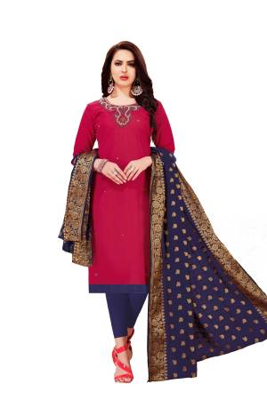 For A Bold And Bautiful Look, Grab This Dress Material In Dark Pink Colored Top Paired With Navy Blue Colored Bottom And Dupatta. It Is Fabricated On Cotton Paired With Banarasi Art Silk Dupatta. 