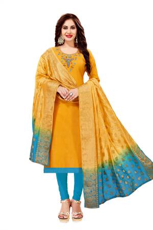 Simple Dress Material Is Here For Your Semi-Casuals With This Dress Material In Yellow Colored Top Paired With Contrasting Sky Blue Colored Bottom And Shaded Yellow And Sky Blue Banarasi Art Silk Dupatta. This Dress Material Is Cotton Based Beautified With Thread And Moti Work.