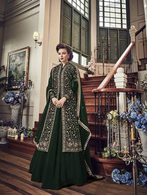 Enhance Your Personality Wearing This Heavy Designer Indo-Western Suit In Dark Green Color Paired With Dark Green Colored Bottom And Dupatta. Its Top IS Fabricated On Velvet Paired With Georgette Bottom And Chiffon Dupatta. Buy This Now.