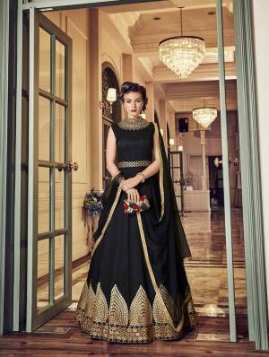 For A Bold And Beautiful Look, Grab This Designer Floor Length Suit In Black Color Paired With black Colored Bottom And Dupatta. Its Top Is FabricatedOn art Silk Paired With Santoon Bottom And Net Dupatta. It Has Rich Elegant Embroidery Over The panel And NEck. 
