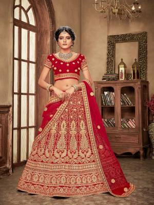 Get Ready For Your Big Day With This Heavy Designer Lehenga Choli In Red Color. This Heavy Embroidered Lehenga Choli Is Fabricated On Velvet Paired With Net Fabricated Dupatta. It Is Beautified With Heavy Jari & Thread Embroidery and Stone Work. Buy Now