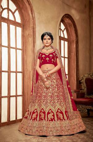 Here Is A Perfect Bridal Look For You With This Heavy designer Lehenga Choli In Red Color. This Lehenga Choli Is Velvet Based Paired With Net Fabricated Dupatta.Its Fabric Also Ensures Superb Comfort Throughout The Gala