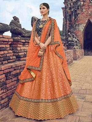 marvelously charming is what you will look at the next wedding gala wearing this beautiful orange color silk fabric with rich jacquard Silk Lehnega. Ideal for party, festive & social gatherings. this gorgeous saree featuring a beautiful mix of designs. Its attractive color and jacquard lehenga with net fabrics work over the attire & contrast hemline adds to the look. Comes along with a contrast unstitched blouse.