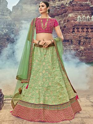 Bring out the best in you when wearing this Light green color Jacquard Silk Fabricated Lehenga. Ideal for party, festive & social gatherings. this gorgeous saree featuring a beautiful mix of designs. Its attractive color and jacquard lehenga with net fabrics work over the attire & contrast hemline adds to the look. Comes along with a contrast unstitched blouse.
