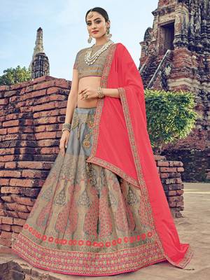 The fabulous pattern makes this a classy number to be included in your wardrobe. pink and grey color. Ideal for party, festive & social gatherings. this gorgeous saree featuring a beautiful mix of designs. Its attractive color and jacquard lehenga with chinon fabrics work over the attire & contrast hemline adds to the look. Comes along with a contrast unstitched blouse.