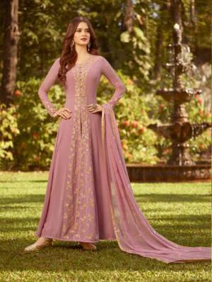 Look Pretty In This Designer Floor Length Suit In Light Pink Color Paired With Light Pink Colored Bottom And Dupatta. Its Top And Dupatta Are Fabricated On Georgette paired With Santoon Bottom. Buy This Now.