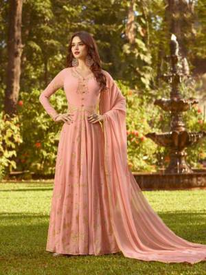 Flaunt Your Rich And Elegant Taste In This Designer Floor Length Suit In Peach Color. This Pretty Suit Is Georgette Based Beautified with Jari And Thread Work. Buy This Suit Now.