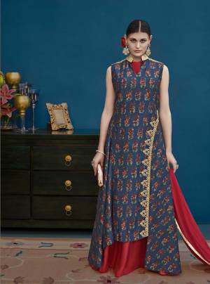 Grab This Designer Floor Length Suit In Navy Blue Colored Top And Bottom Paired With Red Colored Dupatta. Its Top Is Fabricated On Art Silk Paired With Santoon Bottom And Chiffon Dupatta. Its Red Colored Inner Is Giving Highlight To The Dress. 