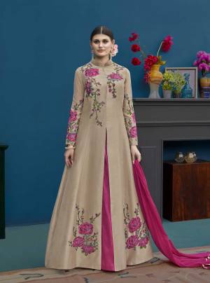 Flaunt Your Rich And Elegant Taste Wearing This Designer Indo Western Suit In Beige Colored Top Paired With Dark Pink Colored Lehenga And Dupatta. Its Top And Lehenga Are Silk Based Paired With Chiffon Dupatta. 